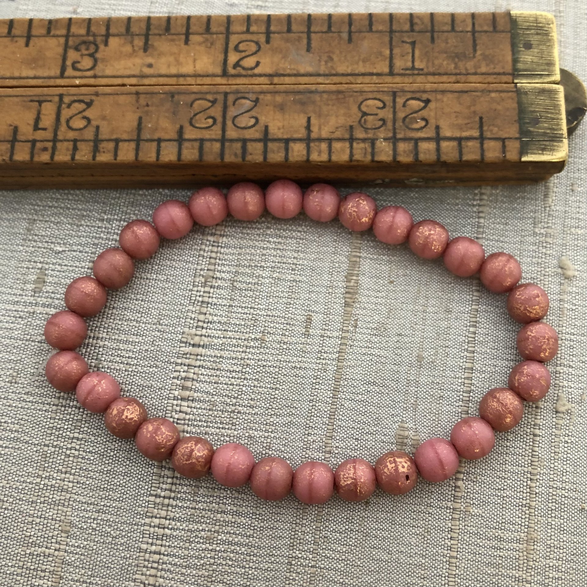6mm Round Druk Dusty Rose with Copper and Etched Finish