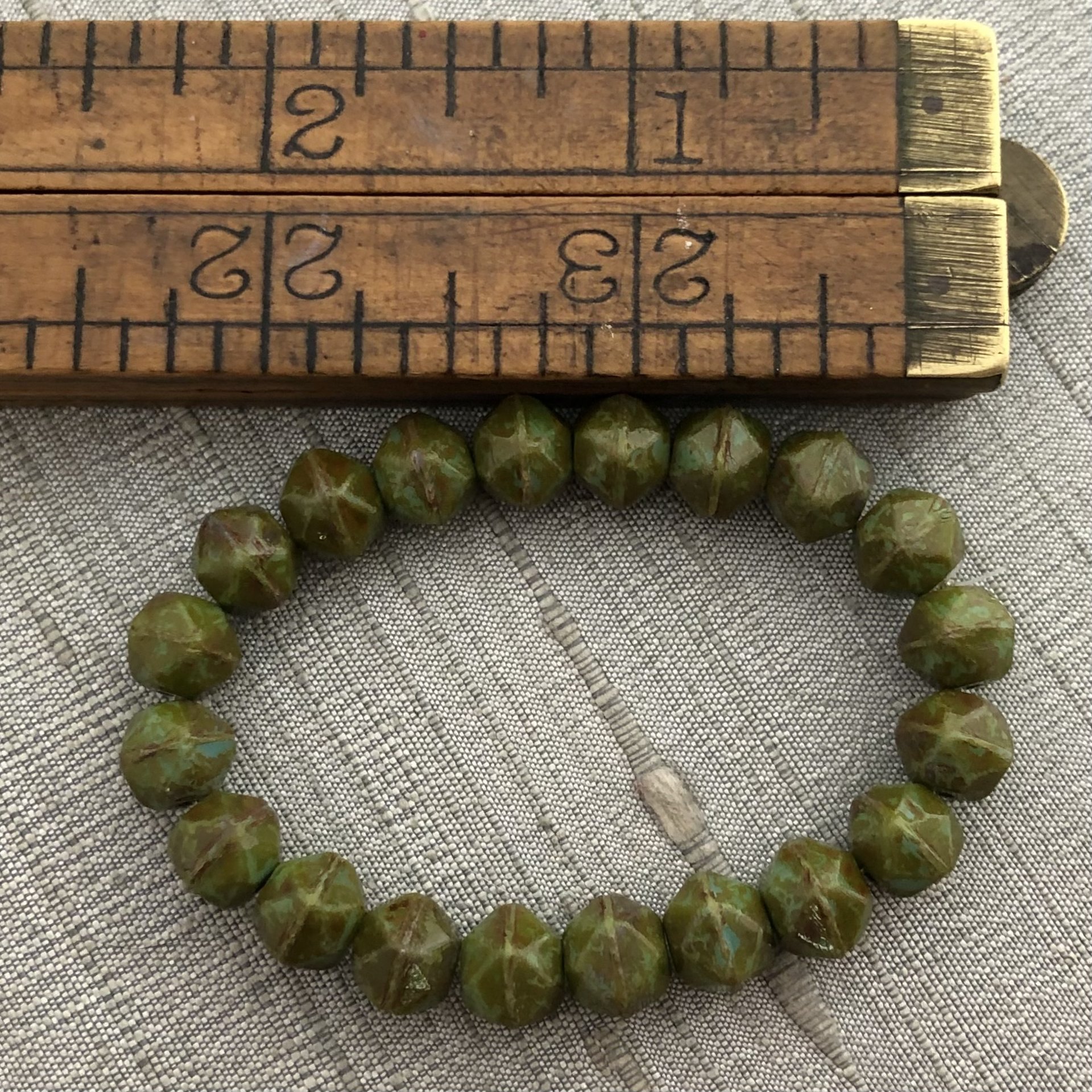8mm English Cut Olive Green with a Picasso Finish