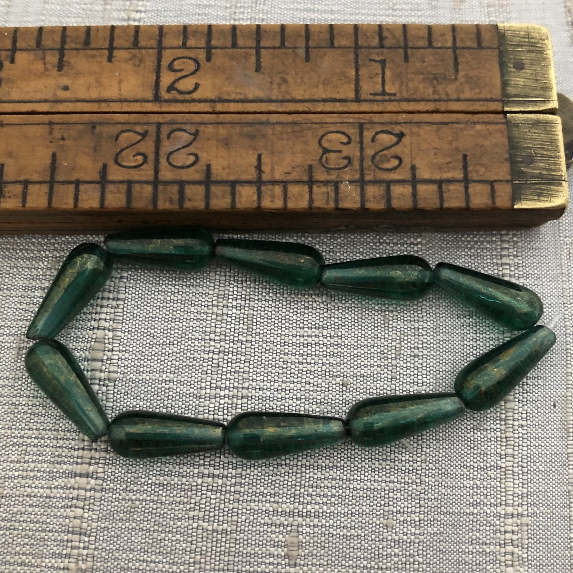 6x15mm Dangle Drop Emerald with a Gold Finish